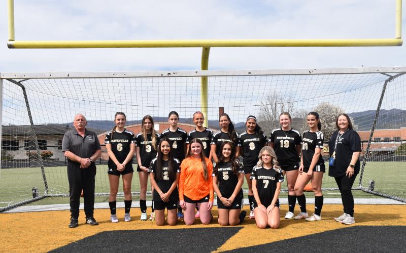 Norashae Patterson • Clay County Progress The Hayesville High School Soccer team players are, front, from left, Noelia Fonceca, Emily Dowling, Alondra Garcia and Emma Elver, back, Head Coach Mike White, Reese Seagars, Leah Thomas, Aydah Judd, Emily Lyvers, Emily Aguilera Garcia, Camila Nava Gamez, Olivia Grizzle, Summer Borchardt and Assistant Coach Kelly Davis.