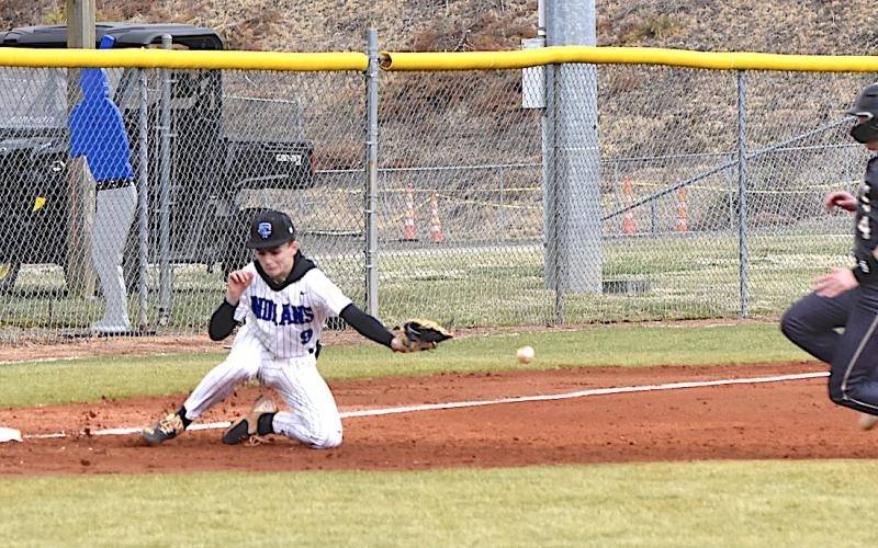 Gary Corsair • Clay County Progress Hayesville's Kendall Boyer slides into third base with a stolen base as the ball eludes Towns County's third baseman during last weeks game in Hiawassee. Hayesville welcomed the Indians for a rematch Wednesday.