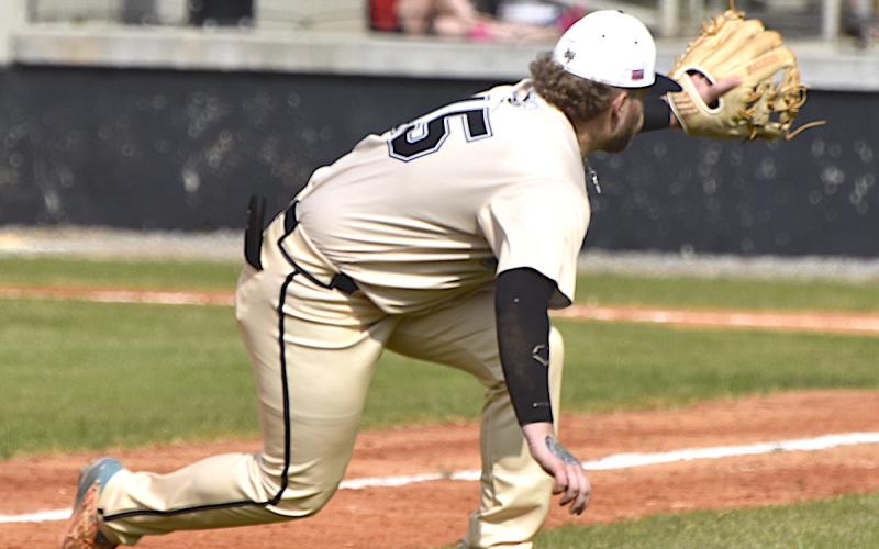 Gary Corsair • Clay County Progress Hayesville third baseman Dawson Devane shows his catlike reflects as he reaches for a foul ball Monday against Cherokee.