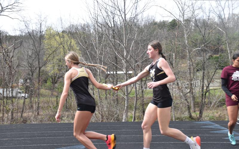 Norashae Patterson • Clay County Progress Lady Jacket relay athletes Ava Shook hands off with Raelynn Wood.