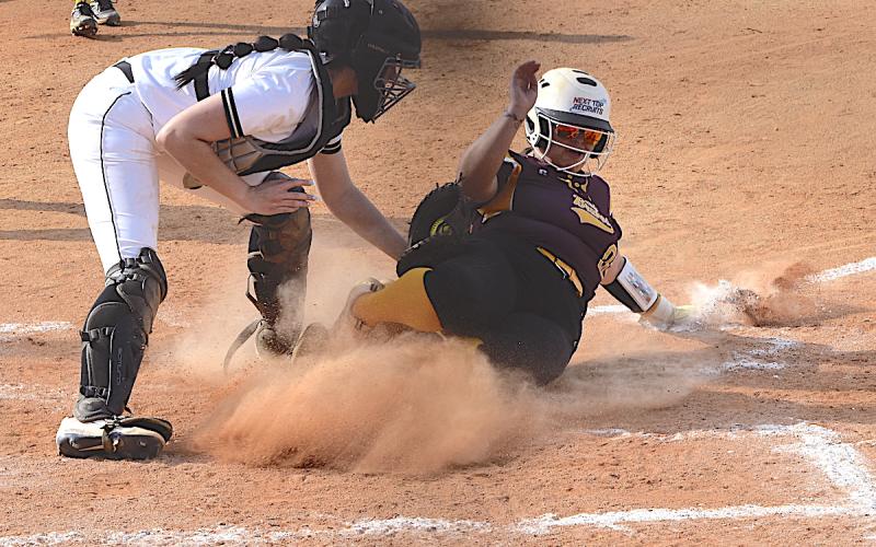 Gary Corsair • Clay County Progress Hayesville catcher Kara Bauer slaps the tag on Amila Lossie as she tries – unsuccessfully – to score