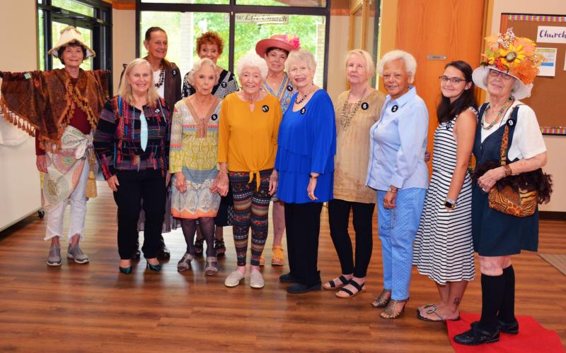 Photo from Facebook page At the Granny's Attic Thrift Store quarterly luncheon volunteers, front, from left, Sandy Jersey, Judy Jeagar, Eva Robinson, Ida Holmes, Katie Dawes, Sandy Lymperis, Lee Brown, Sharon Smith and Ruth Jones; back, Becky Van Gorder, Linda Kennedy and Ruth Coffey wore outfits purchased at the store and did a fashion show. Coffey won.