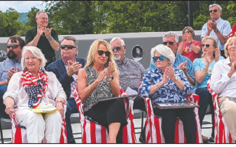 Photo by Dwayne Bradley Rob Peck, Betty Bradley, Debbie Mauney, Merinda Woody, Helen Davis, Teresa McClure and in back row, Randy Nichols, Scotty Penland, Clay Logan and Dwight and Sissie Penland applaud the speaker.