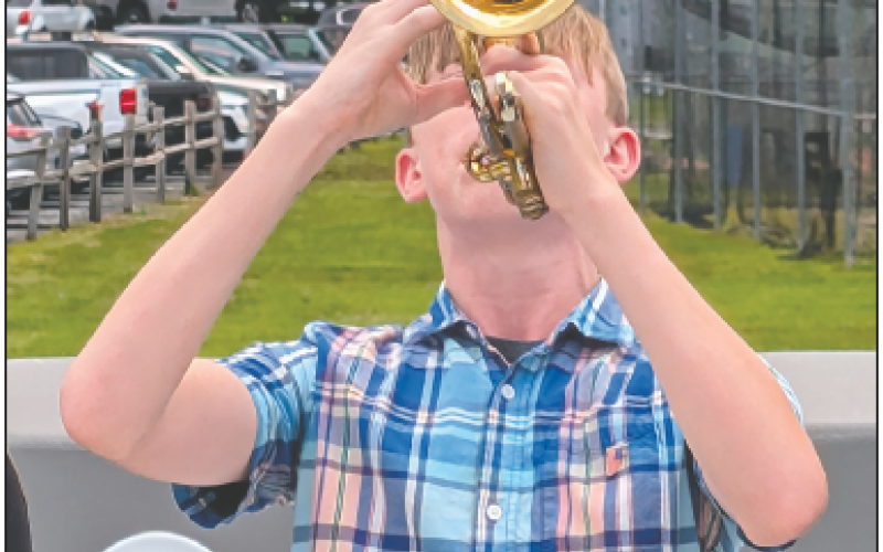 Photo by Dwayne Bradley Hayesville High School Band member Gage Brown plays a moving rendition of “Taps.”