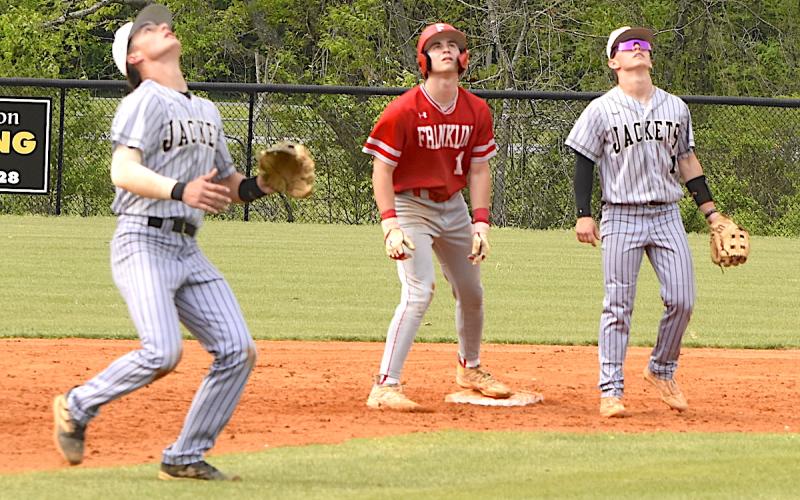 Gary Corsair • Clay County Progress All eyes are on the prize as Hayesville shortstop Tate Roberts camps under a high pop-up that also caught the attention of Michael Mauney.