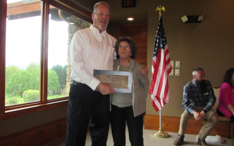 Lorraine Bennett • Clay County Progress Sandy Zimmerman accepting award from Jim Rich for Clay County Volunteer of the Year.