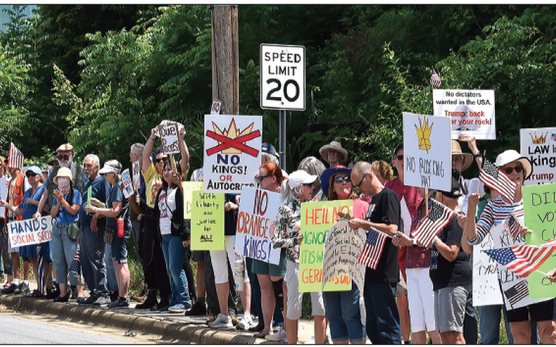 Becky Long • Clay County Progress No Kings protesters line both sides of Old Jailhouse Hill in Hayesville Saturday. The number of local people protesting President Donald Trump’s policies have continually increased over the past few months from the tens to the hundreds.