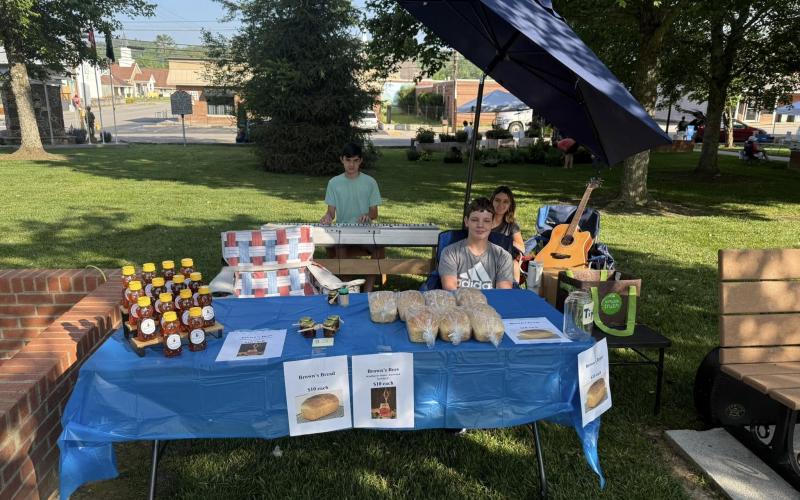 Samuel, Seylah and Seth Brown have been busy selling homemade bread and local honey while also entertaining shoppers with music during the event. They will soon have locally raised Brown’s Beef for sale at the market.