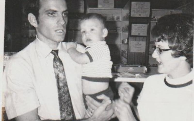 Harold and Anita Lance are shown with their oldest son, John after they purchased the building at 78 Sanderson Street on the Hayesville square. Harold opened their pharmacy and retail store in 1972 and served the community for about 35 years.