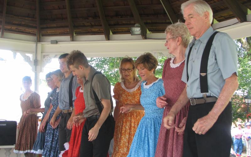 Lorrie Ross• Clay County Progress The John C Campbell Folk School dancers always take the stage first to entertain at The Festival on the Square. The group is composed of veteran dancers and newcomers, both young and old.