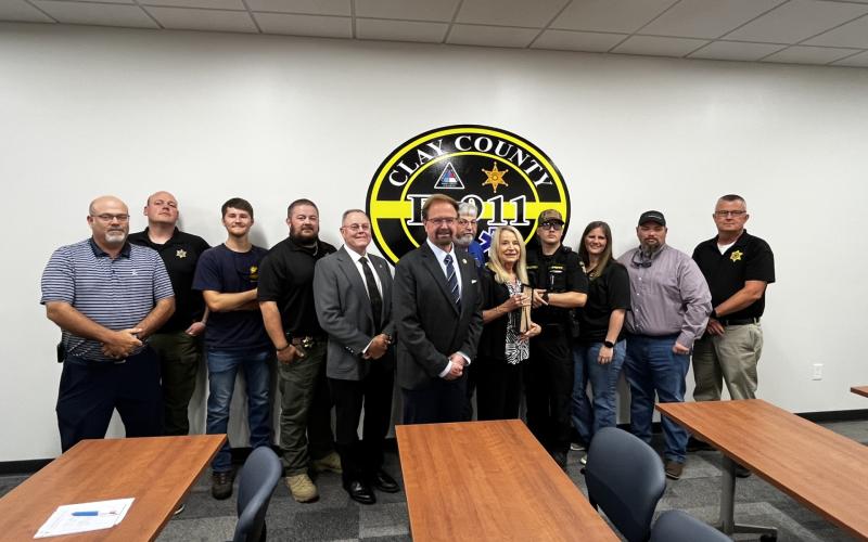 Deby Jo Ferguson • Clay County Progress Congressman Chuck Edwards, center, recognizes emergency workers for their service, from left, Daniel McNabb-Paramedic; CCSO Investigator Brandon Coker; Benton Logan, CCSO; Lt. Tyler Faggard; Sheriff Mark Buchanan; Edwards; Clay County Manager Debbie Mauney; Emergency Management Coordinator Jeff Ledford; CCSO Sgt. Ethan Henderson; Clay County Dispatcher Leann Moore; Paramedic Brandon Bailey and CCSO Chief Deputy Joe Wood.