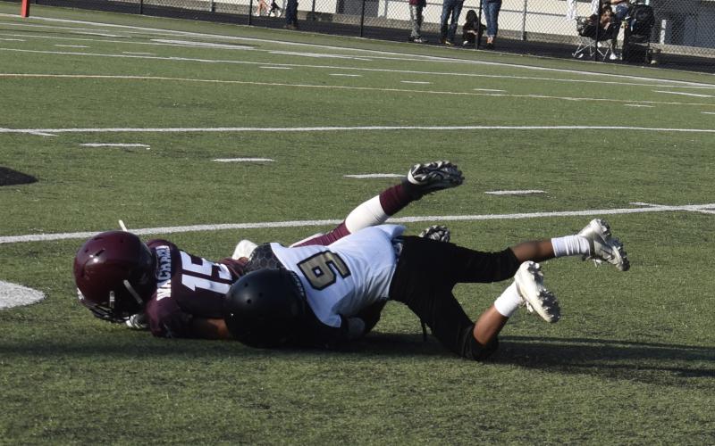 Callie Long • Clay County Progress Termite player Major Pondexter, secures the tackle and insures a touchdown is not made against the Jackets.