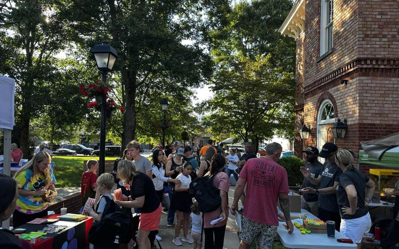 More than 400 people attended Hayesville's Back-to-School Bash on Thursday, Aug. 14, along with several community resources. Attendees received backpacks and a variety of other school supplies, as well as a passports to be stamped towards ice cream from Chinquapins or fried Oreos from a food vendor. Oak Forest Church gave free bags of popcorn as kids prepared to watch the movie, “Inside Out,” on the Beal Center lawn. Sponsored by the Clay Child Collaborative, Clay County Community for Students and Vaya, vis