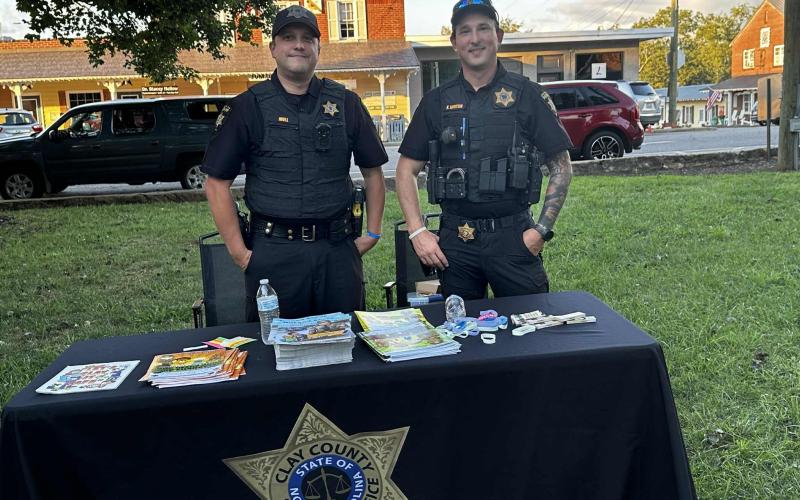 Lorrie Ross • Clay County Progress Clay County School Resource Officers, from left, Shane Mull smiles with his cohort, Kyle Lickteig while handing out information for students and families.
