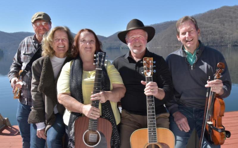 Sweet ‘N Sourwood Honey band features a lineup of five musicians, from left, Shell Traver, Margie Watkins, Shelly Arvidson, Dan Watkins and Steve Vick. They will be performing from 6:30-8 p.m. Saturday, Aug. 23 on the Hiawassee Square.