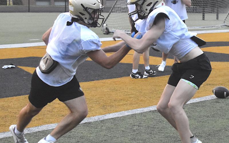 Gary Corsair • Clay County Progress Logan Querns, right, tries to contain Tre Graves during a drill as the varsity Yellow Jackets prepare for Friday's regular season opener at Asheville School.