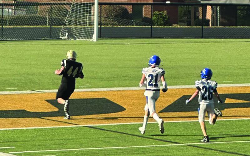 JV Yellow Jacket Grayson Marr out-runs his opponent for a touchdown during Friday’s game.