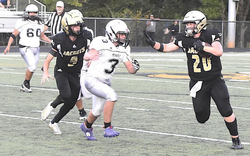 Gary Corsair • Clay County Progress Caden McClure, aka the Clay County Cannonball, shifts into high gear on a Hayesville sweep.