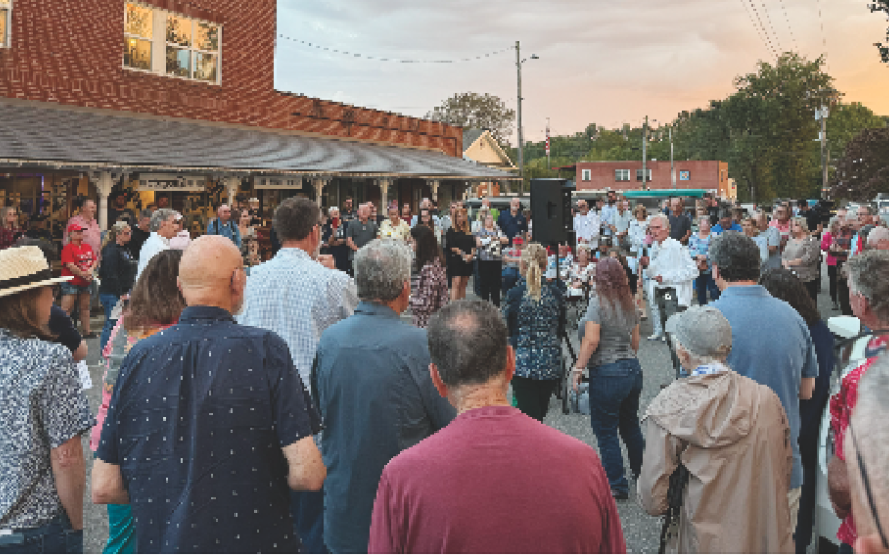 Photo by Tyler Faggard    Dwight Moss gives the opening prayer during a vigil for conservative activist Charlie Kirk.