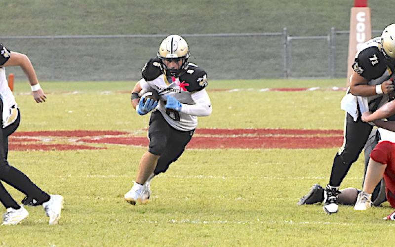 Gary Corsair • Clay County Progress Talk about creating a hole. Hayesville linemen Will Brown, No. 56, Matt Gorham, No. 55, Wyatt James, No. 74, Jonathan Godinz, No. 71 and Brendon Collins, No. 51, punish Copper Basin's trenchmen as Tre Graves, No. 6, explodes through the opening.