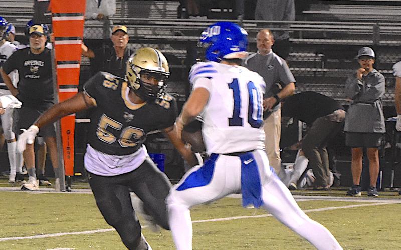 Hayesville sackmaster Will Brown, 56, draws a bead on the quarterback during Hayesville's 35-22 victory.