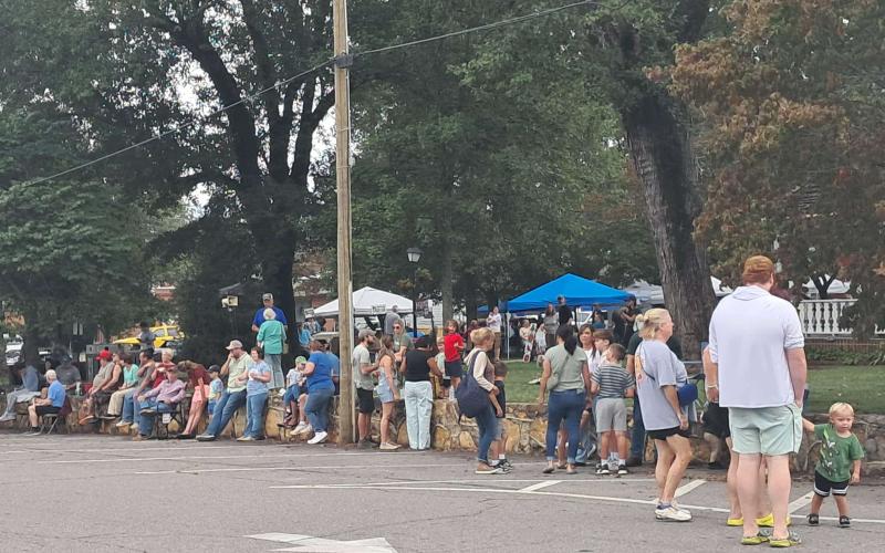 Spectators line the streets of Hayesville waiting for the 12 p.m. tractor parade to begin. The rain held off until the parade was over and many visited the tractors parked on the square.
