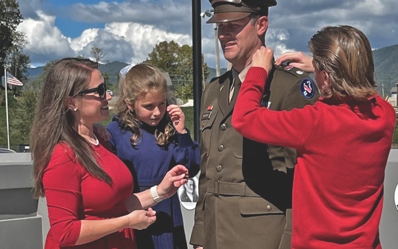 Clay Woody receives help pinning his stars from his wife, Lauren, daughter Carolina and son, Isaac during his promotion ceremony at the Veterans Memorial Park on Friday afternoon.