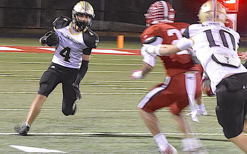 Gary Corsair • Clay County Progress Hayesville's Ben Bethel, No. 4, heads for a first down on one of six receptions he made against East Wilkes.