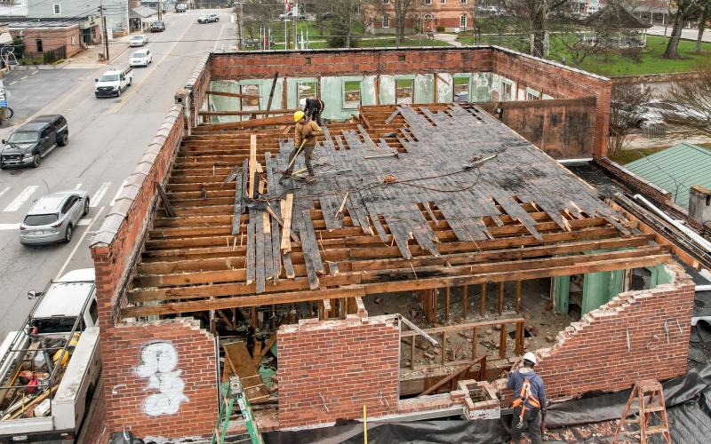 Photo by Ron Wallace Demolition beginning in the upstairs of the old building on the corner of Herbert Street.