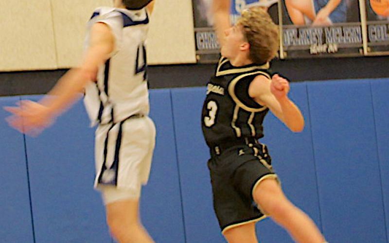 Neal Wachob • Clay County Progress Hayesville's Kyle Shaheen, No. 3, challenges a Nantahala layup.
