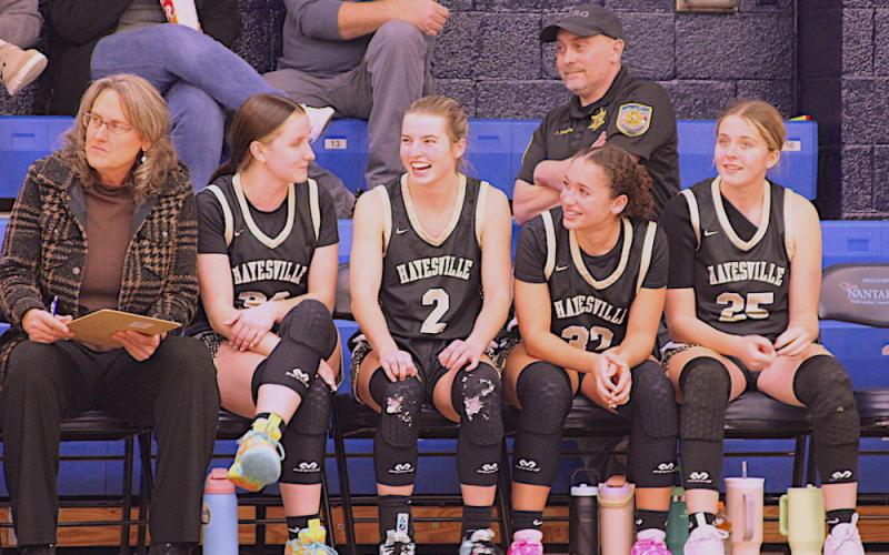 Neal Wachob • Clay County Progress Lady Yellow Jackets Jasmine Brooks, No. 33, Ava Shook, No. 2, Aaliyah Jackson, No. 32, and Breanna Patterson, No. 25, are all smiles after putting the game out of reach at Nantahala. More photos on page B2