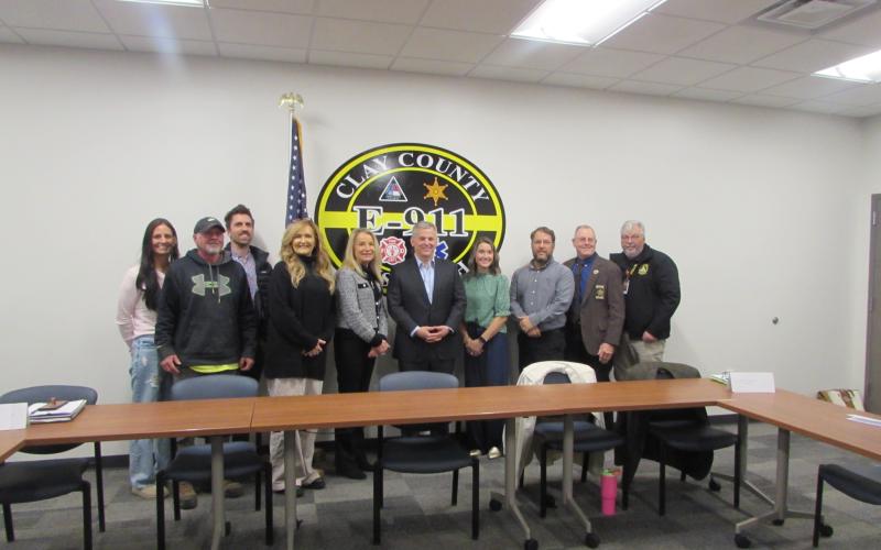 Lorraine Bennett • Clay County Progress From left, Chassidy Oakes, Todd Oakes, addiction specialist Dr. Travis Williams; Stacie Ledford of Rock Bottom Recovery; Clay County Manager Debbie Mauney; Gov. Josh Stein; Health Director Clarissa Rogers; Todd Goins of the Department of Social Services; Sheriff Mark Buchanan and EMS Director Jeff Ledford at the 911 Dispatch Center on Courthouse Drive. Stein learned how the county is using its $1 million in opioid settlement funds.