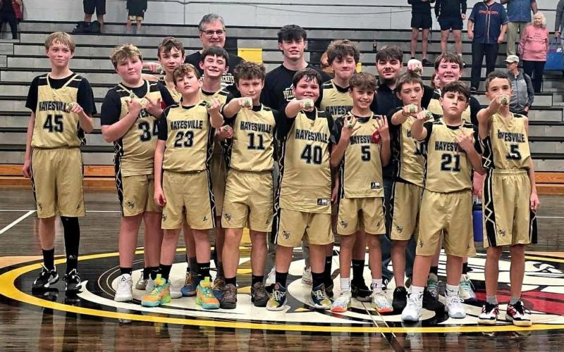 The Hayesville Mites are, from front left, Luke Brooks, Jon David Ray, Gabe Garcia, Martin Ledford, Linkin Blizzard, Maxx Colandrea and Elam Fuerch; center, Eli Payne, Finn Hensley, Max Moore, Gage Jones, Elijah Hughes and Candler Matheson; back, coaches Slade Crouch, Michael Colandrea and Mark Moore.