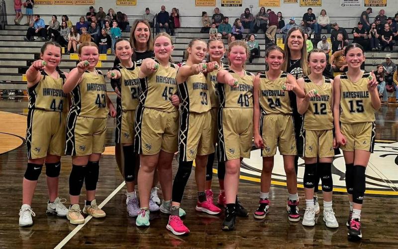 From left, the Hayesville Mites are, Karoline Suggs, Ellisyn Cherry, Landry James, Skylan Stillwell, Mila Michaels, Kyleigh Trapp, Reese English, Bobbie Ledford, Merritt Penland, Gracie Taylor; back, coaches, Jill Baxter and Aneka James.