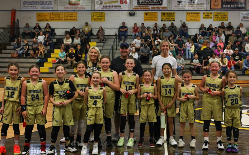 The Termite Girls Basketball Team are, from left, Pella Fuerch, Presley Wagner, Madelyn Reagan-Rudgers, Lily Clampitt, Rialen Finn, Millie Moore, Cora Black, Makenna Acosta, Adalynn Olvera, Adeline Ledford, Kynleigh Cook and Anna Kate Rogers; back, from left, Alicia Moore, Andrew Wagner and Hilary Goodrich Black.