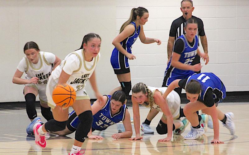 Neal Wachob • Clay County Progress Aaliyah Jackson, No. 32, is off to the races after Hayesville teammate Ava Shook, No. 2, hit the deck to wrestle the basketball away from Towns County and shove the rock to Jackson.