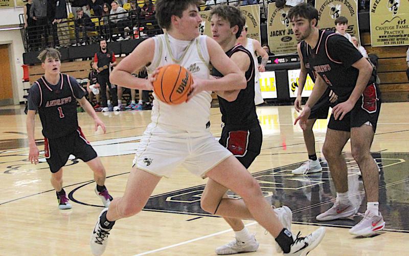 Neal Wachob • Clay County Progress Yellow Jacket big Damien Soto, No. 4, pivots as he powers his way to the basket for two of his team-high16 points against Andrews.
