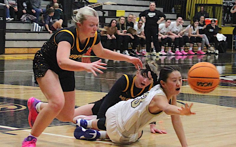 Neal Wachob • Clay County Progress Lucy Trout, No. 3, hits the floor in an attempt to save the ball for Hayesville.