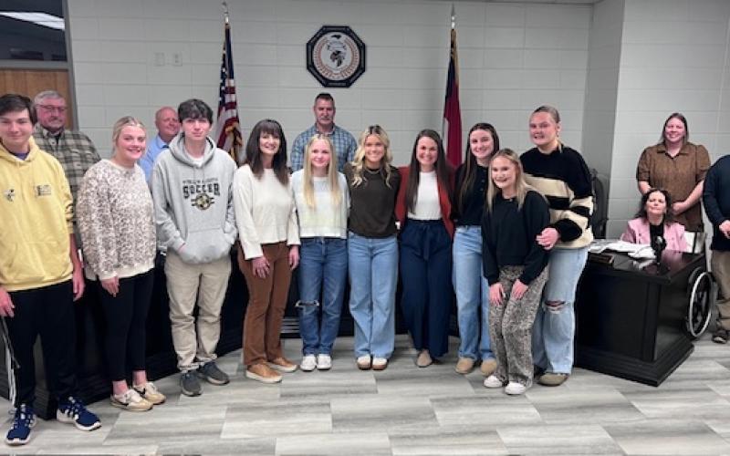 Angel Owens • Photo Clay County Schools students and teachers are, front, from left, Will Jennings, Lily McClure, Zach Moral, Teacher Michelle Rhinehardt, Jadyn Kimber, Marleigh Lowe, Teacher Kayla Clonts, Jasmin Brooks, Madison Sullivan and Ava Moore. They were recognized during the Board of Education meeting on Monday, Feb. 23. School board members are, back, from left, Danny Jones, Robert Caldwell, Chairman Jason Shook, Board Member Kelly Crawford, Superintendent Melissa Godfrey and Board Member Josh Ash