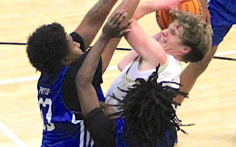 Neal Wachob • Clay County Progress Hayesville’s Kabe Shaheen muscles through an Albemarle double team on a second-quarter drive.