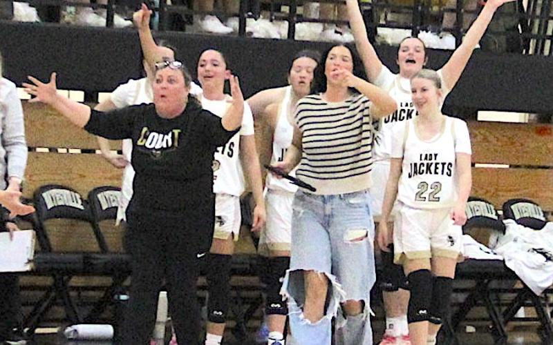 Neal Wachob • Clay County Progress Hayesville Coach Tammy Dills and student manager Bryleigh Krieger protest a ruling that Caroline Wade’s buzzer beating shot did not count while players Aaliyah Jackson, Kayla Brown and Alley Gaddis, No. 22, celebrate the miraculous basket. The ruling was overturned and the shot declared valid after officials conferred.