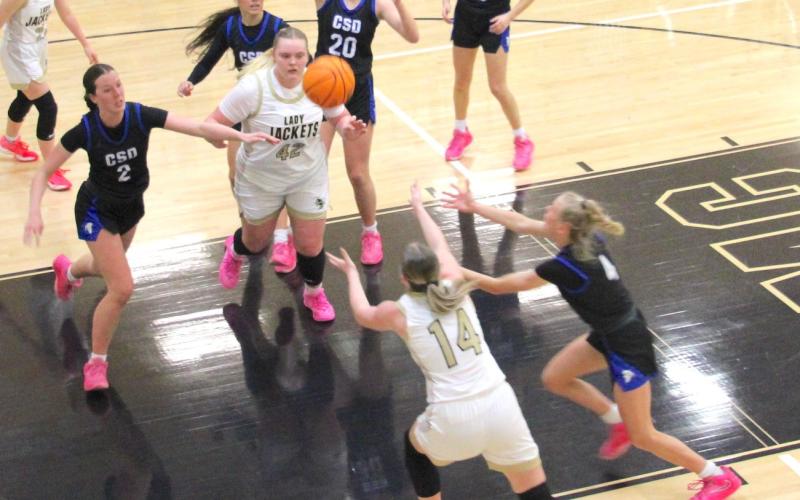 Neal Wachob • Clay County Progress Lady Yellow Jackets Ava Moore, No. 42, and Briley Clampitt, No. 14, fight to gain possession of a missed shot.