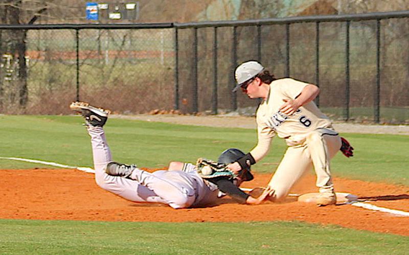Neal Wachob • Clay County Progress The infield umpire called the runner safe on this pickoff play but it sure looks like Hayesville first baseman Landon Cheeks, No. 6, has the sack blocked as he makes the tag.