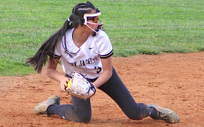 Neal Wachob • Clay County Progress Hayesville shortstop Lucy Trout gets down to stop a hot grounder at Robbinsville.