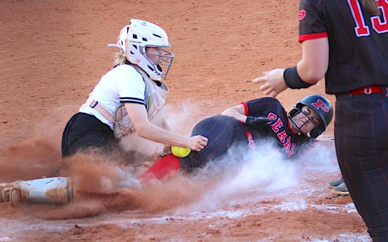 Neal Wachob • Clay County Progress Hayesville catcher Caroline Wade reaches for the softball during a home-plate collision with a Pisgah Bear.