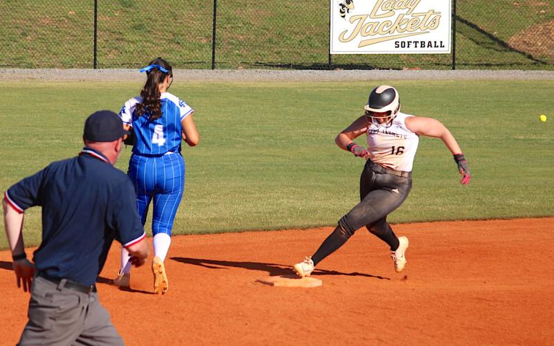 It's full speed ahead for Danielle Anderson as she rounds second and sets sail for third base.