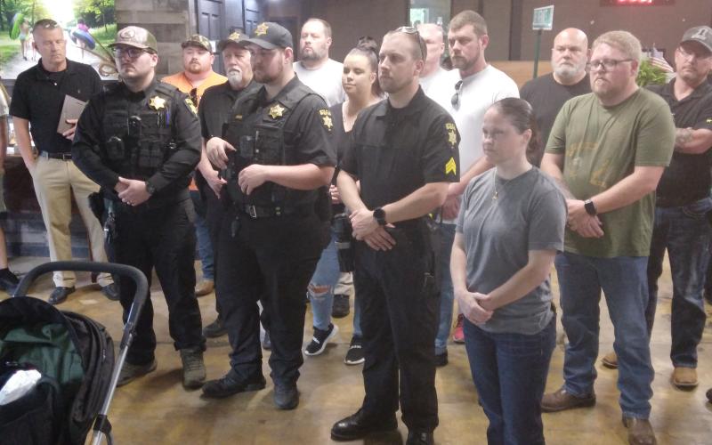 Deputies receive challenge coins from Henry Mitchell, Special Assistant to Congressman Chuck Edwards.