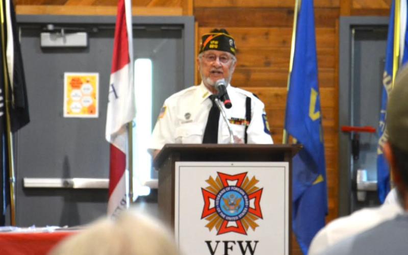 Former Post Commander Bob Bond explains the meaning of each item on the POW/MIA Table.