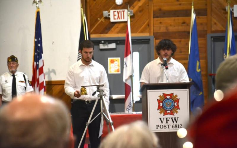 Hayesville High School students read the names and ring the bell for each Clay County service member lost.
