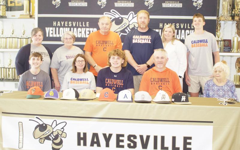 Front from left, Rhett, Tessa, Jackson, Joe Jack and Edna Mae Sellers; back Carrissa Daniels, Denise and Charlie Shelton, Rob, Marissa and Matthew Peck are witnessing Jackson's signing with Caldwell Community College.